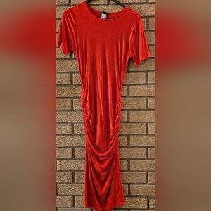 Gently worn Coral Red bodycon dress with ruched sides. Worn once.